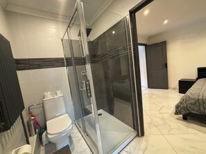 Shower, hair dryer, towels, soap