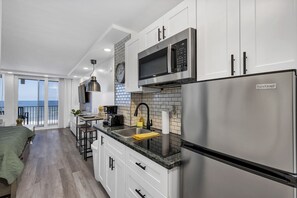 Microwave, coffee/tea maker, cookware/dishes/utensils, paper towels