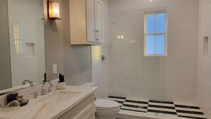 Shower, hair dryer, towels, soap
