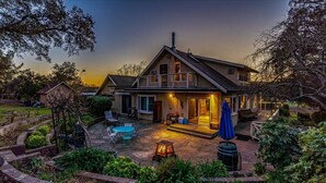 A two-story house with a patio, outdoor seating, and a swimming pool. - Eastside Eden - Pool, Hot Tub and Tastings Included (Healdsburg)