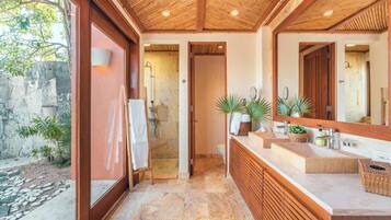 Shower, hair dryer, towels, shampoo