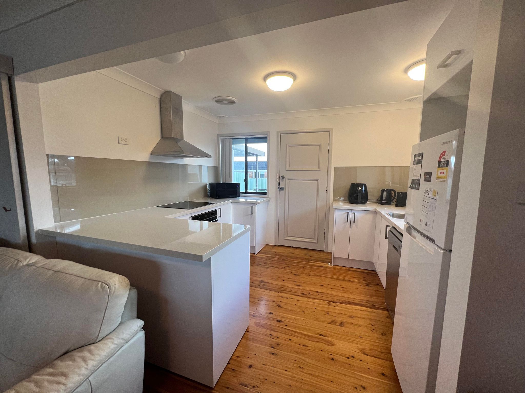 Fridge, stovetop, dishwasher, dining tables