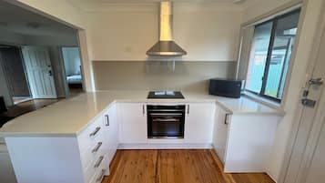 Fridge, stovetop, dishwasher, dining tables