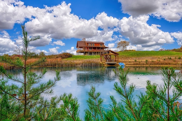Private fishing pond and 11 acres make for a sprawling retreat.