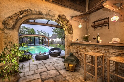 La Case à Tom with enclosed wooded park, private swimming pool, children's playground in Lozère