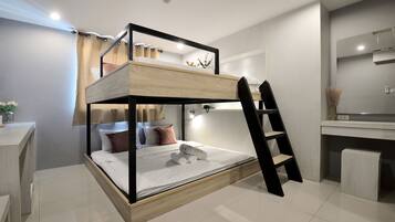 Family Room | Premium bedding, down comforters, in-room safe, individually decorated