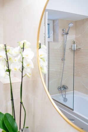 Shower, hair dryer, towels, soap