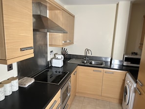 Apartment, 1 Double Bed | Private kitchen | Full-sized fridge, microwave, stovetop, dishwasher