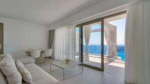 Superior Suite, Hot Tub, Sea View | Living area | Flat-screen TV - LIVINGHOME SUITES (Parga)
