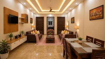 Comfort Apartment | Living area | 32-inch flat-screen TV with digital channels, TV
