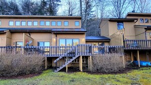 A wooden cabin-style building with multiple windows and a balcony. - Lakeside Serenity, Lakeside Serenity (Jackson County)