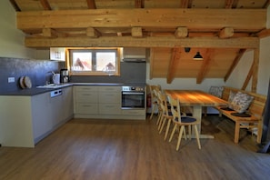Fridge, stovetop, dishwasher, coffee/tea maker