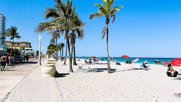 On the beach, white sand, beach towels, 15 beach bars