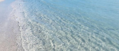 On the beach, white sand, beach towels, 15 beach bars