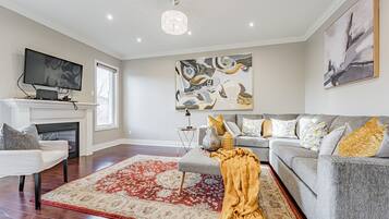 Luxury Villa | Living area | 55-inch Smart TV with digital channels, TV, fireplace