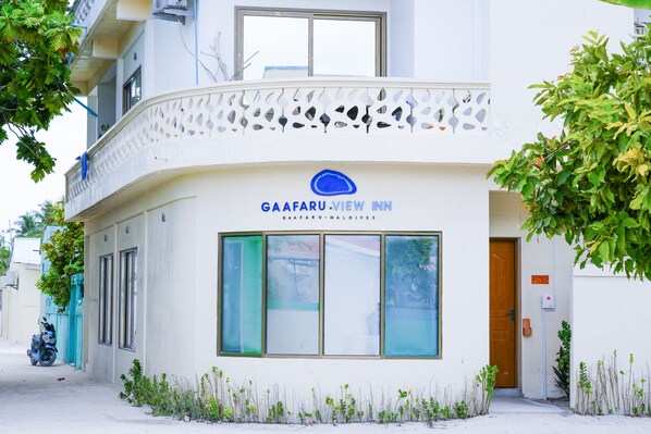 A building with a sign reading "GAAFARU.VIEW INN Maldives".