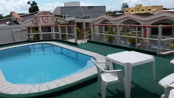 Seasonal outdoor pool, pool loungers