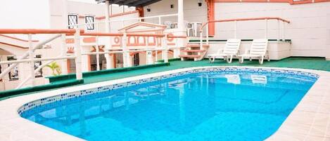Seasonal outdoor pool, pool loungers