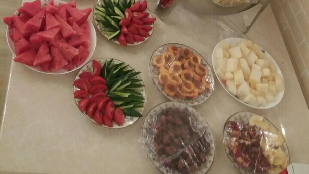 A buffet table with various food items and a self-service beverage station. - Hotel Diyor (Samarkand)