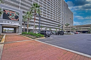 A multi-story hotel with a prominent sign reading "THE WHARF". - Excellent Location & Amenities at Laketown Resort - Perfect for Extended Stays.  (Panama City Beach)