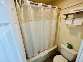 Standard Room | Bathroom | Bathtub, towels, soap, toilet paper