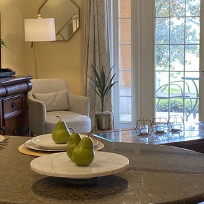 Enjoy a serene atmosphere with a view of lush greenery from the comfort of this inviting space.