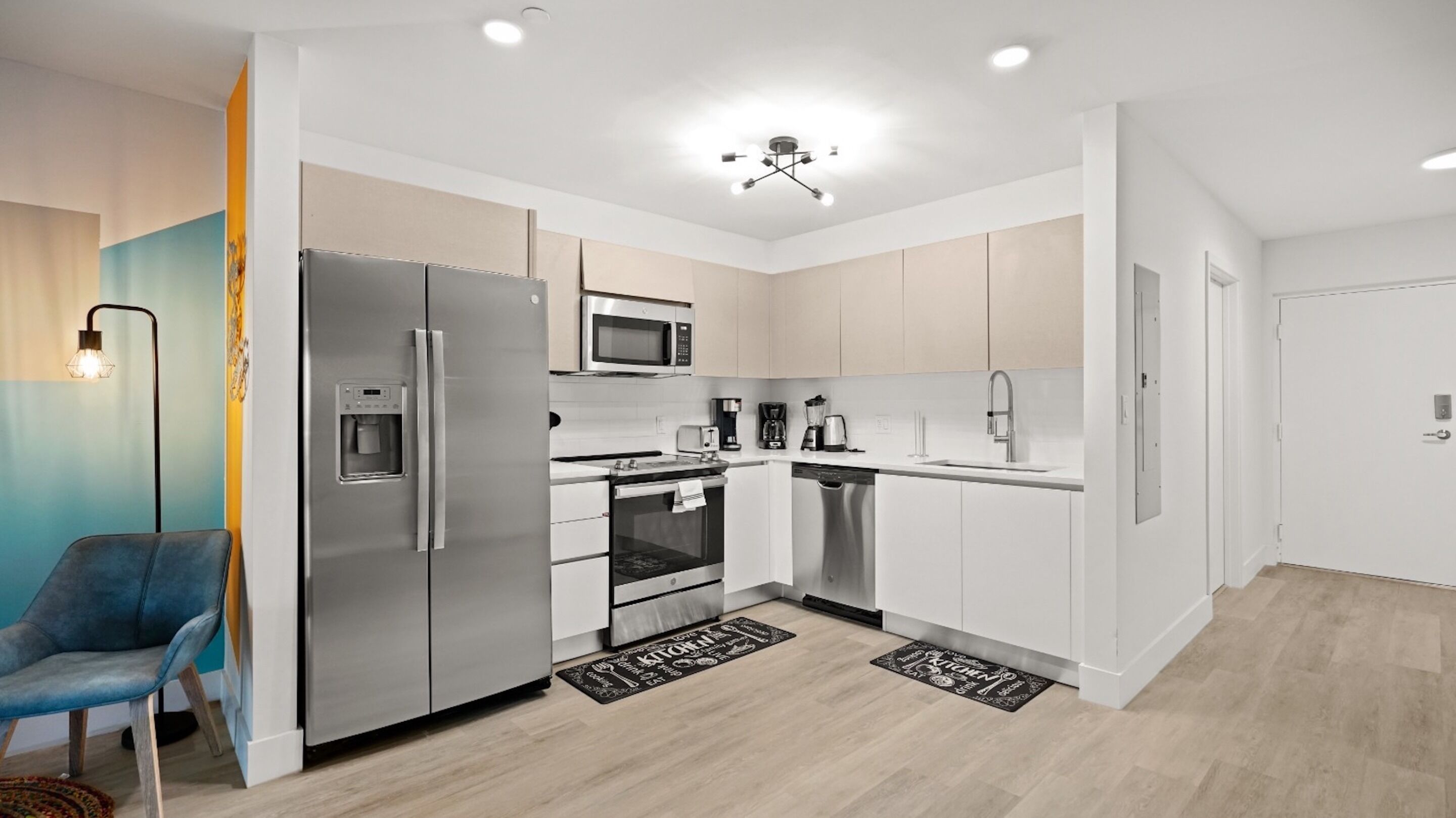 A modern kitchen with stainless steel appliances, a microwave, and a dishwasher.