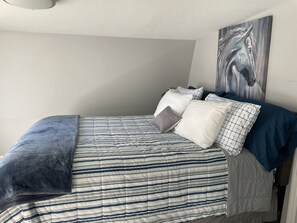 1 bedroom, desk, iron/ironing board, travel crib