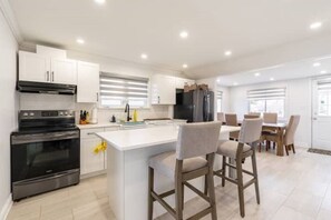 Microwave, oven, stovetop, dining tables