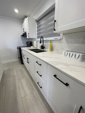 Microwave, oven, stovetop, dining tables