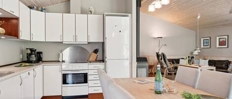 Fridge, stovetop, dishwasher, coffee/tea maker