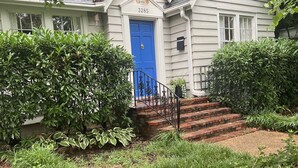 A house with a blue front door, number 3285, and a brick staircase leading up to it. - Charming Three Bdrm Home on Quiet Street- Near U of M - Fully Fenced Yard- (Memphis)