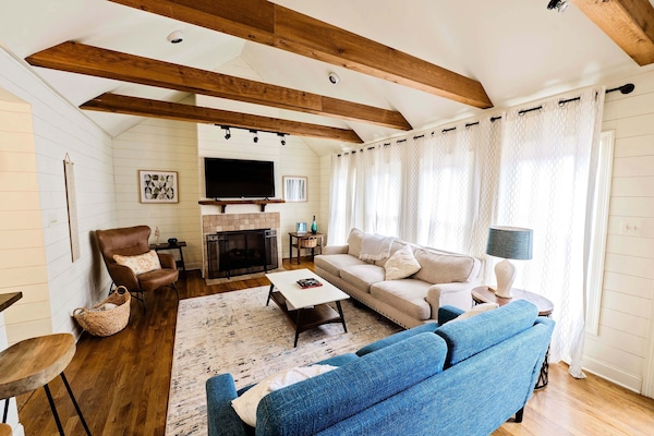 Large family room with 55" Roku TV.