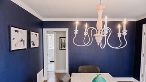 A dining area with a table, chairs, and a chandelier. - Charming Three Bdrm Home on Quiet Street- Near U of M - Fully Fenced Yard- (Memphis)