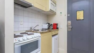 Apartment | Private kitchen | Fridge, microwave, oven, stovetop