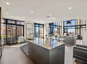 Apartment | Private kitchen | Fridge, microwave, stovetop, cookware/dishes/utensils