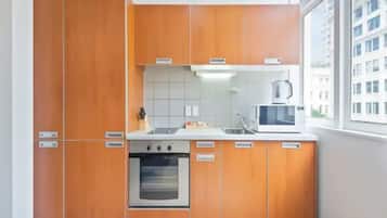 Apartment | Private kitchen | Fridge, microwave, stovetop, cookware/dishes/utensils