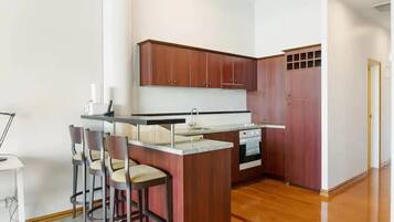 Apartment | Private kitchen | Fridge, microwave, stovetop, cookware/dishes/utensils