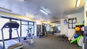 A gym with treadmills, elliptical machines, and various exercise equipment. - Pool, Gym And Style In The Cbd (Auckland)