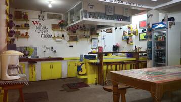 Mini-fridge, microwave, stovetop, coffee/tea maker