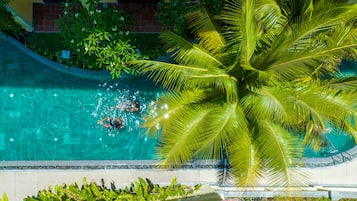 2 outdoor pools, open 7:00 AM to 7:00 PM, pool umbrellas, pool loungers