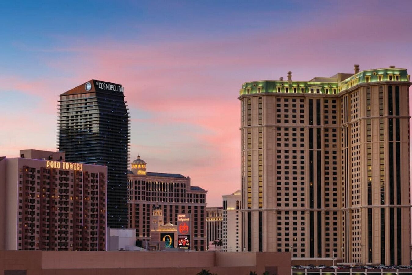 A cityscape with high-rise buildings, including a casino and a hotel.