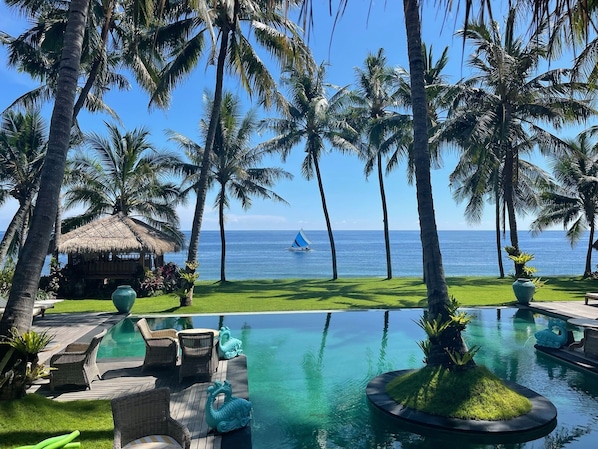 2 outdoor pools, pool umbrellas, pool loungers