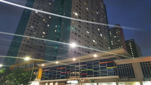 A modern building with multiple floors and illuminated windows. - S&A Property 5 (Jakarta)