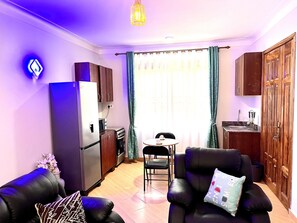 Living area - C&A Orchid Apartment in Buziga Munyonyo (Kampala)