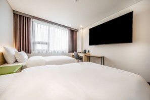 Deluxe Twin kamer | Een kluis op de kamer, verduisterende gordijnen, gratis wifi, beddengoed
