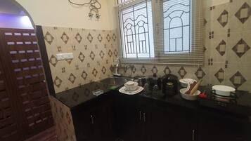 Fridge, coffee/tea maker, electric kettle, cookware/dishes/utensils