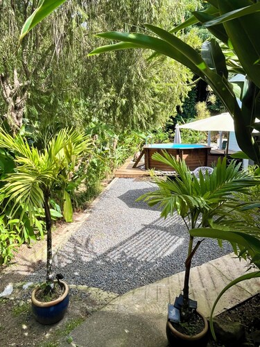 Gites Les Vanilles lush tropical garden swimming pool 800m from the beach