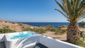 A modern outdoor pool area with a clear view of the sea. - Pure Seaside Calm, Far from Santorini’s Crowds (Thira)