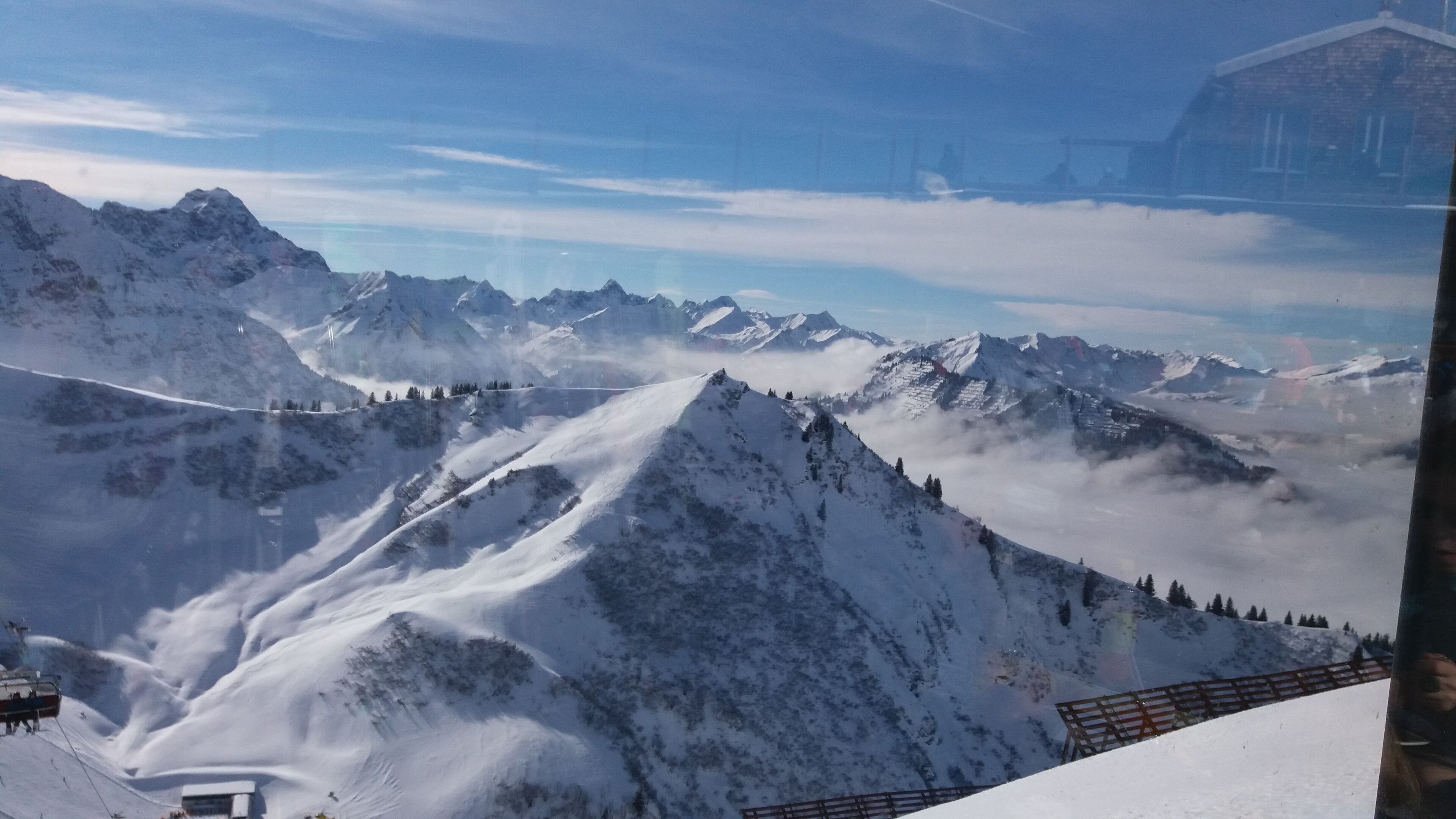 A snow-covered mountain landscape with a clear sky.